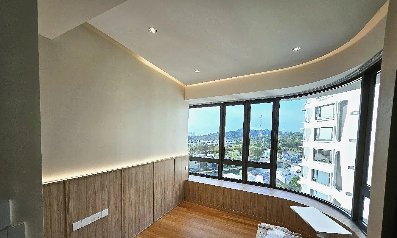 A study with full-height built-in timber cabinetry, a curved bay-window bench and a cove-lit ceiling following the curve of the glazing